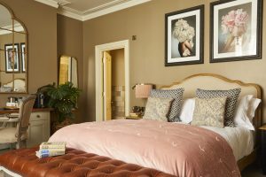 Image of a bedroom interior at the Broad Street Townhouse, Bath, demonstrating artwork installation by Indigo Art Ltd.