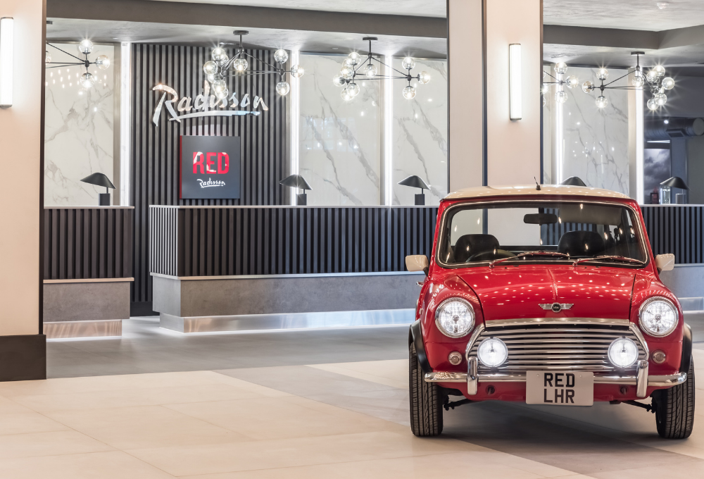 Reception with red mini | Radisson Heathrow